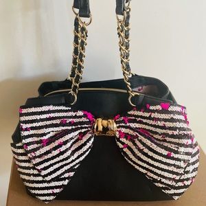 Betsey Johnson Bow-lesque handbag with reversible pink and striped sequin bow